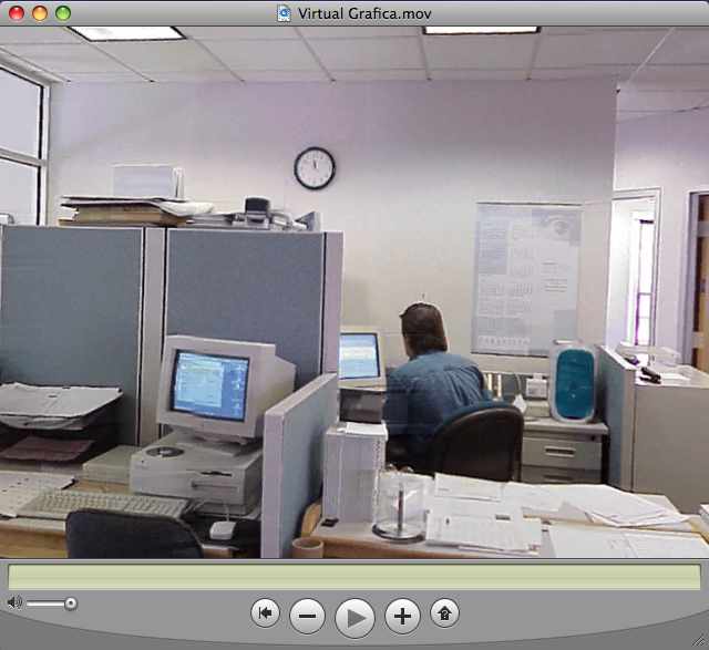 Screen grab of a virtual tour including the office setting of an ad agency with a blue-and-white Macintosh G3 and CRT monitor.